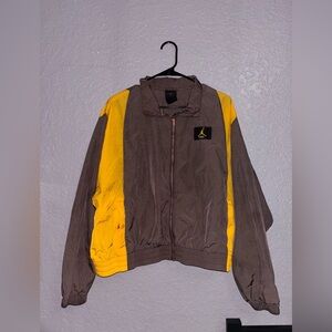 Nike Jordan woven jacket in brown with gold panels